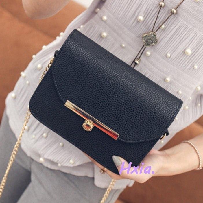 Petit sac à main en cuir avec bandoulière