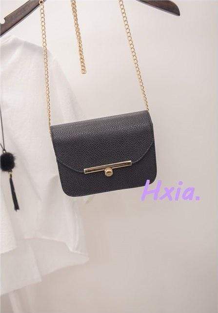 Petit sac à main en cuir avec bandoulière
